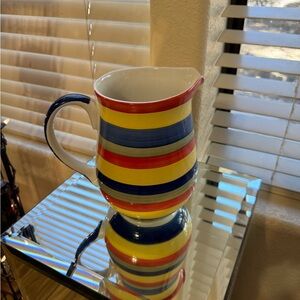 Beautiful Swirl brand multicolored pitcher that is hand painted.
